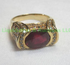 lot 324 image: 14K Ruby and diamond ring, Approx size 7