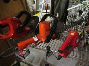 lot 105 image: BLACK AND DECKER ELECTRIC 20 TRIMMER MODEL# HT2000, BLACK AND DECKER ELECTRIC 22 HEDGE TRIMMER AND HOMELITE CORDLESS SHEARS MODEL# UT44172 AND MORE