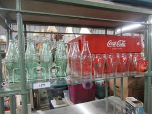 lot 159 image: COCA-COLA VINTAGE BOTTLES WITH WIRE HOLDER, COKE GLASSES, VINTAGE BOTTLES, PLASTIC BOTTLE CARRIERS AND PLAYING CARDS