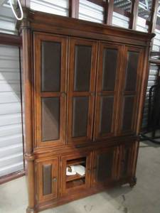 lot 10 image: WOOD 2 PIECE WOOD ENTERTAINMENT CENTER MISSING 1 PANEL 56 X 23 X 80