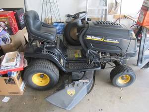 lot 2 image: MTD YARD MACHINES RIDING LAWN TRACTOR WITH 20HP BRIGGS & STRATTON MOTOR, 46 TRIPLE BLADE CUTTING DECK, AUTOMATIC CRUISE CONTROL AND FOOT PEDAL DRIVE. THIS TRACTOR WAS RECENTLY STARTED AND MOVED. NEEDS NEW BATTERY AND AIR IN FRONT TIRE RUNSCUTS GREAT