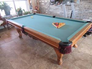 lot 3 image: SARATOGA GOLDEN WEST BILLIARDS CUSTOM MADE POOL TABLE MEASURES APPROX. 98 X 52 X 31 SLATE MEASURE 4.2 X 8.2 BEAUTIFUL ORNATE CARVINGS ON TABLE. IT WAS RECENTLY APPRAISED FOR $1200.00 TO $1500.00