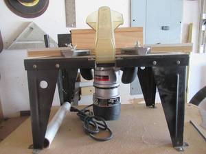 lot 10 image: DRILL MASTER 2HP FIXED BASE ROUTER ITEM# 68341 ON ROUTER TABLE