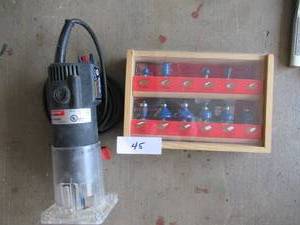 lot 45 image: DRILL MASTER 14 TRIM ROUTER WITH LIFETIME 12 PIECE SET OF ROUTER BITS