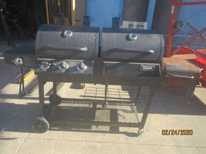 lot 39 image: OUTDOORGOURMET GRILL  DOUBLE BARREL GAS AND CHARCOAL