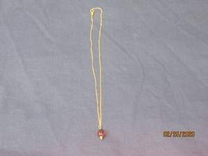 lot 5 image: 14KT GOLD CHAIN WITH CHARM