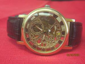 lot 6 image: ROLEX WATCH WITH LEATHER BAND