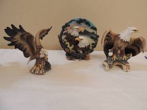 lot 67 image: Double eagle standing plate mountain dcor is background 8.5 x 8.5  and American eagle wings spread out made in china size 7x8 American eagle made in china on wood log wings down 7 x 6