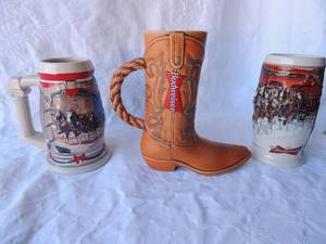 lot 77 image: BUDWEISER BEER STEINS - 2001 HOLIDAY HOLIDAY AT CAPITOL CS455  2006 HOLIDAY STEIN - SUNSET AT THE STABLE   BOOT STEIN - BRAZIL  1994