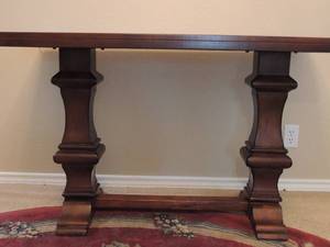 lot 45 image: SOFA TABLE 48L X 28H X 19 D   BROWN WOODEN - DOUBLE PEDISTAL - ASHLEY FURNITURE