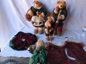 lot 118 image: 2 maroon fabric stockings ,Christmas themed Mommy 23, daddy 24 and baby 16 BEAR , small tree skirt and a hand made Santa
