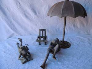 lot 121 image: Metal yard art - Umbrella stand 21   tall frog sitting in chair 2 pieces frog 15 long,  chair 8x5   FROG READING 16L   4 PCS TOTAL