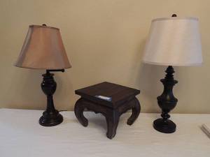lot 49 image: TWO TABLE  LAMPS - DARK GOLDEN  AND   CRME COLOR  BOTH WITH SHADES   and   WOOD FOOT STOOL  12 X 12 X 10