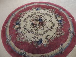 lot 53 image: LARGE OVAL AREA RUG - MARROON  CRME WITH VARIOUS COLOR FLORAL DESIGN - 90 DIAMETER - UNBRANDED