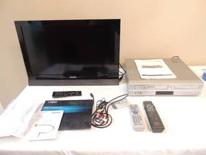 lot 56 image: VIZIO TELEVISION WITH  MANUELS & REMOTE     POLAROID VHS-DVD PLAYER WITH MANUEL