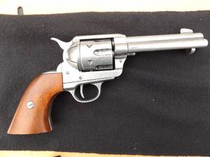 lot 124 image: PROP GUN -  NON FUNCTIONAL Denix Colt 45 Peacemaker Revolver Replica Old West Revolver with Wood Grips      Wood grips. Antique gray gun metal finish ,  These replicas are intended for collection, display and decoration only.
