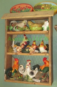 lot 93 image: Rooster & Hen figurines in farm style display box, 17 x 26