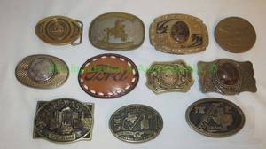 lot 178 image: Assorted belt buckles including Ford, Brass, Texas Alamo and more as shown. 11 total
