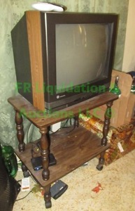 lot 224 image: GE television with remote and stand