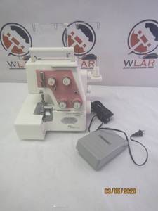 lot 4 image: NEW HOME MYLOCK 234D SEWING MACHINE