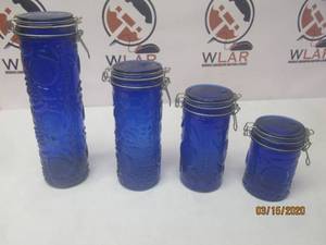 lot 153 image: TOTAL OF 4 COBALT BLUE ELEMENTS GLASS CANISTERS&nbsp WITH FRUIT DESIGN &amp CLAMP LID SEAL&nbsp
