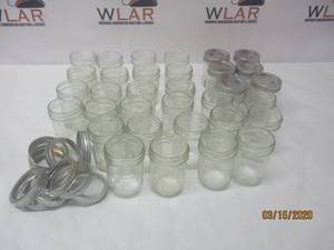 lot 164 image: TOTAL OF 33 VINTAGE 6OZ&nbsp MASON JARS&nbspBALL &amp FRUIT DESIGN&nbspSOME WITH LIDS&nbsp