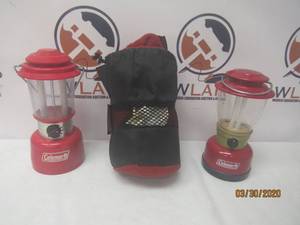 lot 312 image: TOTAL OF 3 PC COLEMAN&nbsp33X75 COLEMAN FLEECE RED SLEEPING BAG WITH CARRY BAG &amp 2 COLEMAN LANTERN MODEL 5328  5344-703