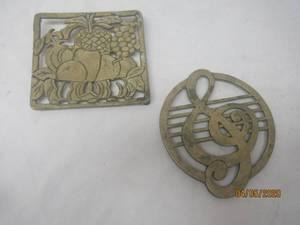 lot 372 image: TOTAL OF 2 BRASS TRIVETS-FRUIT DESIGN &amp MUSIC SYMBOL