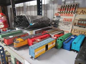 lot 5 image: TOY TRAIN ENGINES, BOX CARS, TRANSFORMER, TRAIN TRACKS AND MUCH MORE TOY TRAIN SUPPLIES