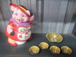 lot 11 image: CERAMIC PIG KITCHEN DIVA COOKIE JAR AND VINTAGE PLANTERS PEANUT COLLECTABLE TIN SERVING SET FEATURING MR. PEANUT 1 - 6 DISH AND 4 - 3 DISHES