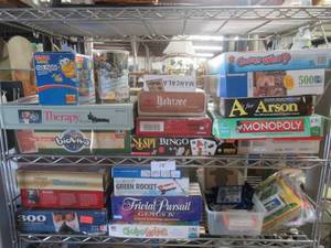 lot 15 image: PUZZLES AND BOARD GAMES INCLUDING YATZEE, MONOPOLY, TRIVIAL PURSUIT, GO FISH AND MANY MORE