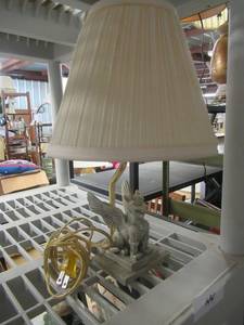 lot 44 image: GRIFFINLAMMASUSHEDU SCULPTURE WITH BRASS COLORED LAMP POST AND LAMP SHADE