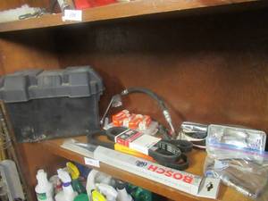 lot 135 image: AUTOMOTIVE SUPPLIES INCLUDING BATTERY BOX, OXYGEN SENSOR, AUTOLITE SPARK PLUGS PLUG# 26, GATES FAN BELT KO60841, DYNA-CORD 952K6 AND 17 BOSCH WIPER BLADES