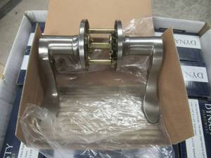 lot 157 image: DYNASTY DOOR HARDWARE MONTEREY LEVER PASSAGE (DOOR KNOBS) IN SATIN NICKEL SOME NEW AND SOME USED BUT ALL THERE PART# MON-82-US15. TOTAL OF 17 IN BOXES.