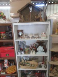 lot 182 image: CHRISTMAS DECORATIONS INCLUDING WOODEN MANGER, CERAMIC TRAIN, CERAMIC SANTA, SNOWMAN SALT AND PEPPER SHAKERS, STUFFED REINDEER AND ELEPHANT, FAUX POINSETTIA AND MUCH MORE