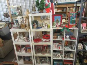 lot 191 image: CHRISTMAS DECORATIONS INCLUDING SMALL TREES, SNOWMEN, SLEDS, PLATES, CERAMIC FIGURES, ANGELS, BOOKS, COFFEE CUP SET AND MUCH MORE
