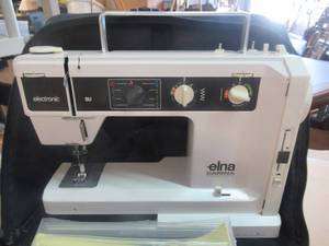 lot 218 image: ELNA CARINA SU 55 SEWING MACHINE IN CASE WITH ALL CORDS AND FOOT PEDAL ALSO INCLUDES SEWING PATTERNS, HOW TO SEW BOOKS AND SEWING ACCESSORIES