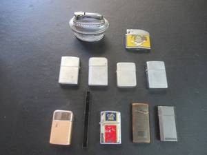 lot 223 image: LIGHTER COLLECTION INCLUDES ZIPPO TYPE LIGHTERS, BUTANE LIGHTERS AND MORE