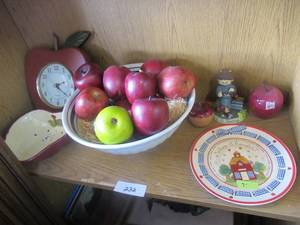lot 233 image: BOWL WITH FAUX FRUIT, APPLE SERVING DISH, APPLE CLOCK, AND MORE