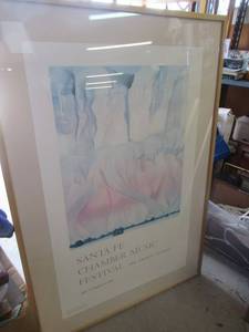lot 255 image: SANTA FE CHAMBER MUSIC FESTIVAL POSTER OF GEORGIA OKEEFES CLIFFS BEYOND ABIQUIU, 1943 FRAMED 32 X 47