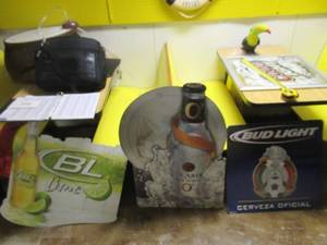 lot 280 image: BUD LIGHT LINE TIN SIGN 28 X 24, BACARDI SILVER O3 TIN SIGN 26 X 35 AND BUD LIGHT CERVEZA OFICIAL TIN SIGN 24 X 24