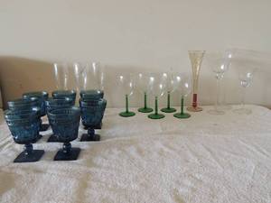 lot 32 image: 4 wine glasses clear with green bottoms, 8 dark blue goblets with square bottoms, 4 champagne glasses silver decor , 3 long stem wine glasses and more