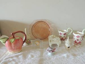 lot 35 image: Pink serving platter 11 diameter porceline piano  design, mudpie 1998 house, glass clock, Apple picture by Robert Allen, 2 rose glasses praying hands, snow globe inside bell and more