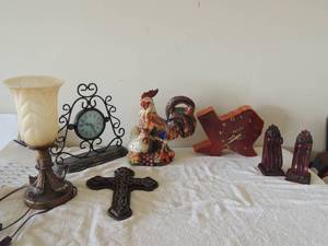 lot 44 image: Misc. lot-metal clock 14x14 gold lamp with glass top 15 high, glass rooster with baby 12.5 H wall cross 13 high 2 maroon curtain rods Texas shape clock Bryant grain 12x12