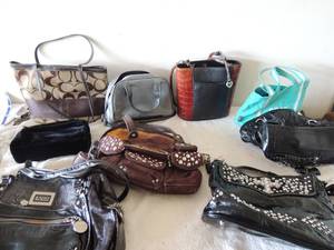 lot 48 image: Large lot of womens purses some with matching wallets including a like new Coach bag with wallet