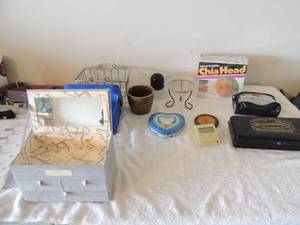 lot 59 image: Misc. lot of jewlery box, blueheart shaped tin , blue cloth box, national farm life tin chia pet new in box and more