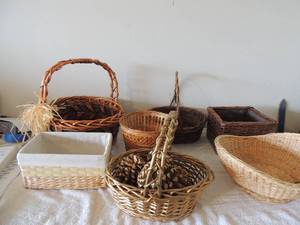 lot 60 image: 8 various wicker baskets, one cloth lined, one with handles one with pine cones etc.