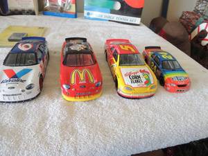 lot 61 image: Pink Pong table NIB Nascar racer game hand held NIB 1969 hat wheel car NIB Play station 2 memory card  8mb NIB and 4 Nascar racers no box