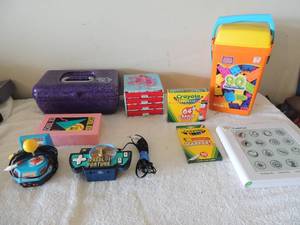lot 68 image: USB wheel of fortune handheld game, packman USB game, Flash pad works, pencil box with colors and markers pencils, box of mega building blocks, crayon factotu box and more..