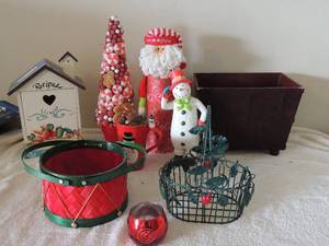 lot 108 image: Christmas lot-foam gingerbread peppermint tree, sants, Christmas coffee mug, 2005 Christmas snowman green metal basket maroon  magazine bin and bird house recipe box